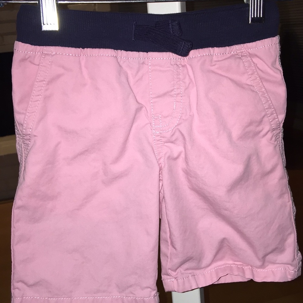 Pink shorts with navy band at top